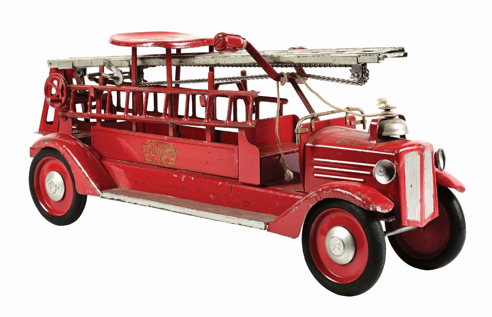 KEYSTONE PRESSED STEEL RIDE-ON FIRE LADDER TRUCK: Decals on both side say "Keystone Aerial Ladder 79." CONDITION: Two original ladders, original seat, original bell and original front headlights. Original black rubber tires over metal disc wheels. So