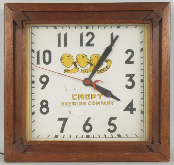 Croft Brewing Company Wooden Clock.: Circa 1935 to 1940. Tin face featured the three Lemon Heads. Light wear on face with some mild color interruption and light case wear. Operates nicely. Condition (Excellent). Size 18" x 18 - 3/4".
