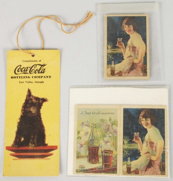 Coca-Cola Bookmark & 2 Needle Cases.: 1920s and 1940s. Only the lightest of any wear. Condition (Excellent - Near Mint). Size Largest: 5 - 1/2" x 2 - 1/2".