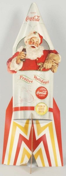 1957 Coca-Cola Santa in Rocket Cutout.: Minor paper chipping, delamination at bottom, and light soiling. Condition (Excellent). Size 32 - 1/2" T.