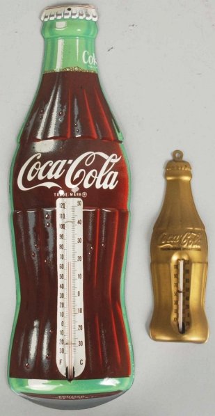 Lot of 2: 1950s Coca-Cola Tin Bottle Thermometers: Both are fairly clean with just small marks in a few spots. Condition (Near Mint). Size Largest: 16 - 1/4" T.
