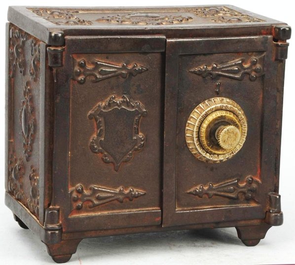 Cast Iron Double Front Door Safe Still Bank.: Circa 1899. Attributed to Shimer. Red painted version. Nickel combination dial. Working original dials and disks in lock but locking bar is missing. Condition (Excellent). Size 6" T.