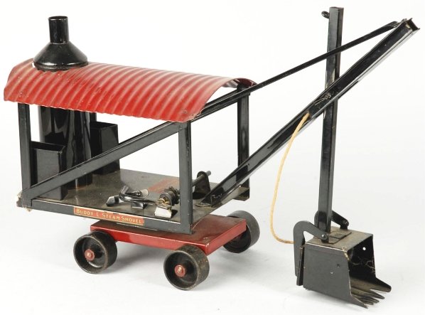 Pressed Steel Buddy L Steam Shovel.: American. Circa 1924. Early model with no boiler door. Maintains its original shovel cord and has very minor play wear. Condition (Excellent). Size 21" L.