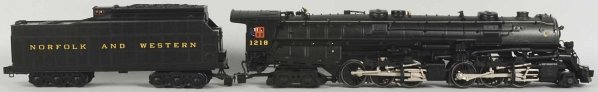Lionel Train Steam Engine & Tender.: Contemporary. No. 1218 engine pulling matching Norfolk & Western tender. Includes original box with some wear. Condition (Excellent - Near Mint).