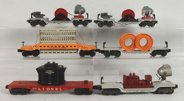 Lot of 6: Lionel Post-War Specialty Train Cars.: Includes three searchlight cars, no. 6818 transformer car, no. 6561 cable car, and no. 6519 Allis-Chalmers car. Two lenses are detached from the searchlight cars but are present. Condition (Very Good)