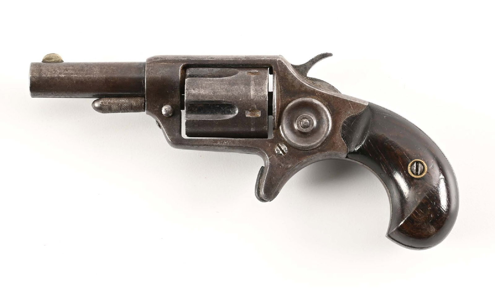 (A) FIRST MODEL COLT NEW LINE SINGLE ACTION REVOLVER.: Manufactured in 1874. Etched panel, "COLT NEW 32". Two line address on top of the barrel, "COLT'S PT. F. A. MFG. CO. / HARTFORD,CT. U.S.A.". Two piece smooth rosewood grips. Half moon front sight. CON