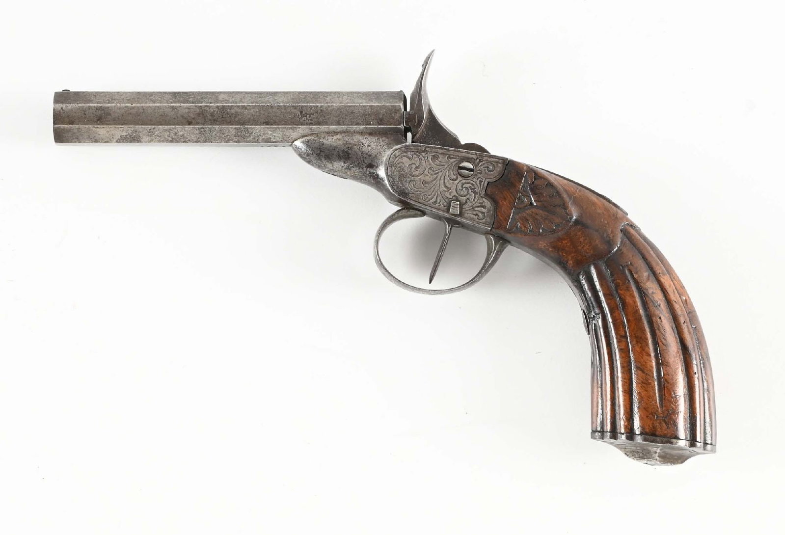 (A) ENGRAVED ANTIQUE BELGIAN RIMFIRE SINGLE SHOT PISTOL.: Typical late 19th century Flobert style parlor pistol with fluted one piece walnut grips, octagonal barrel, and engraved frame. CONDITION: Very good. Shows as an all patina example. Excellent grips. W