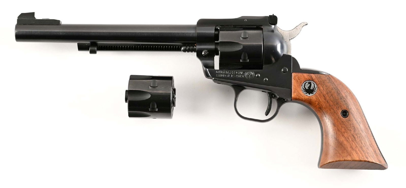 (C) EARLY RUGER SINGLE SIX CONVERTIBLE SINGLE ACTION REVOLVER (1968).: Features blue finish, target adjustable rear sight, and walnut grips with Ruger medallions. Comes with box, paperwork, and spare cylinder for .22 Win Mag. CONDITION: Excellent. Shows as near new with 