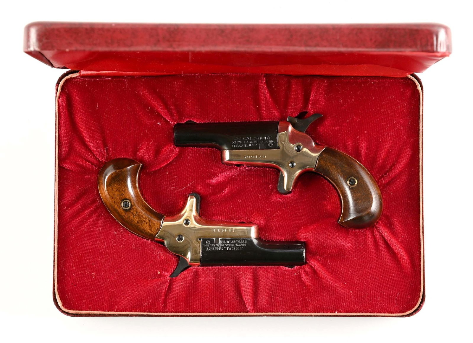 (C) CASED SET OF 4TH MODEL COLT DERRINGER SINGLE SHOT PISTOLS.: Lot consists of a pair of 4th Model Colt Derringers. Both with walnut bird head grips and blue barrels. They have consecutive serial numbers and are housed in a Colt jewelry type case. CONDITION: Exce