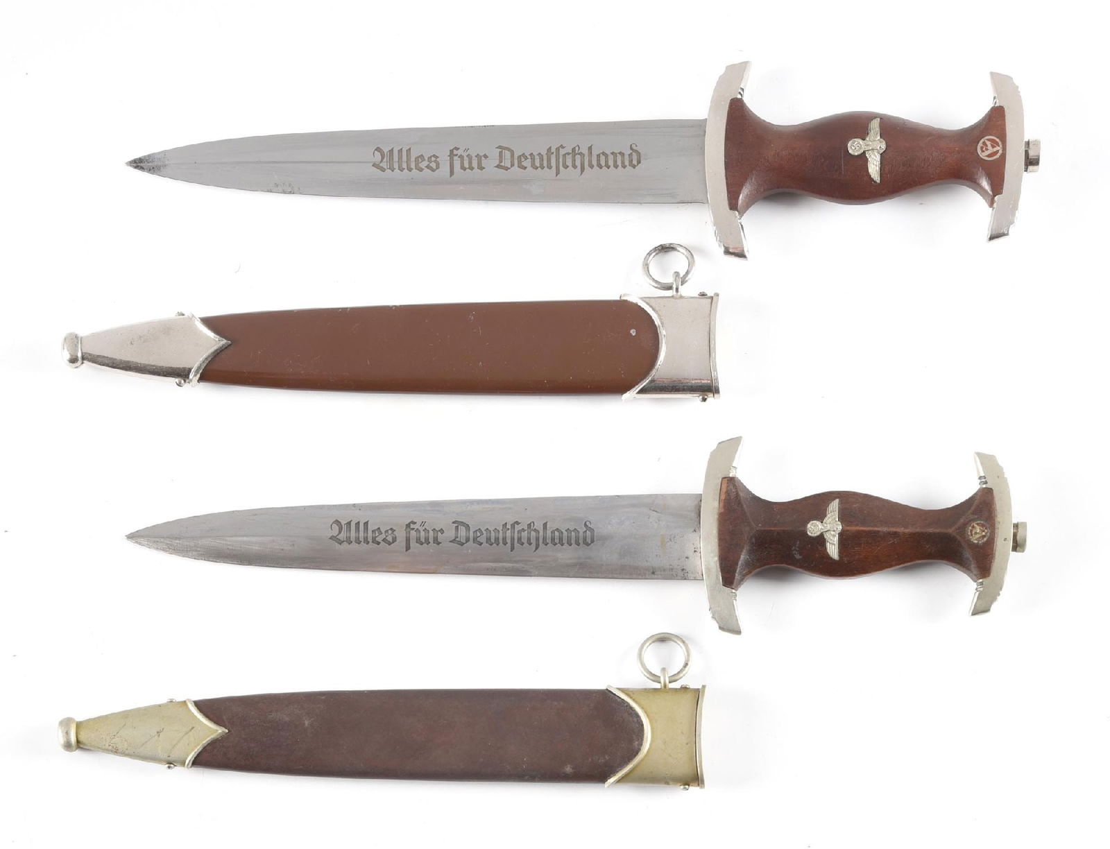 LOT OF 2: GERMAN WWII SA DAGGERS.: Lot consists of (A) Marked "RZM M7/38" on blade with spurious Rohm inscription. Bright blade with runner marks, bright plated fittings, and grip with inset eagle and SA roundel. Complete with brown pa