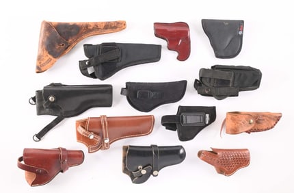 LARGE LOT OF 12 MISCELLANEOUS PISTOL AND REVOLVER HOLSTERS.