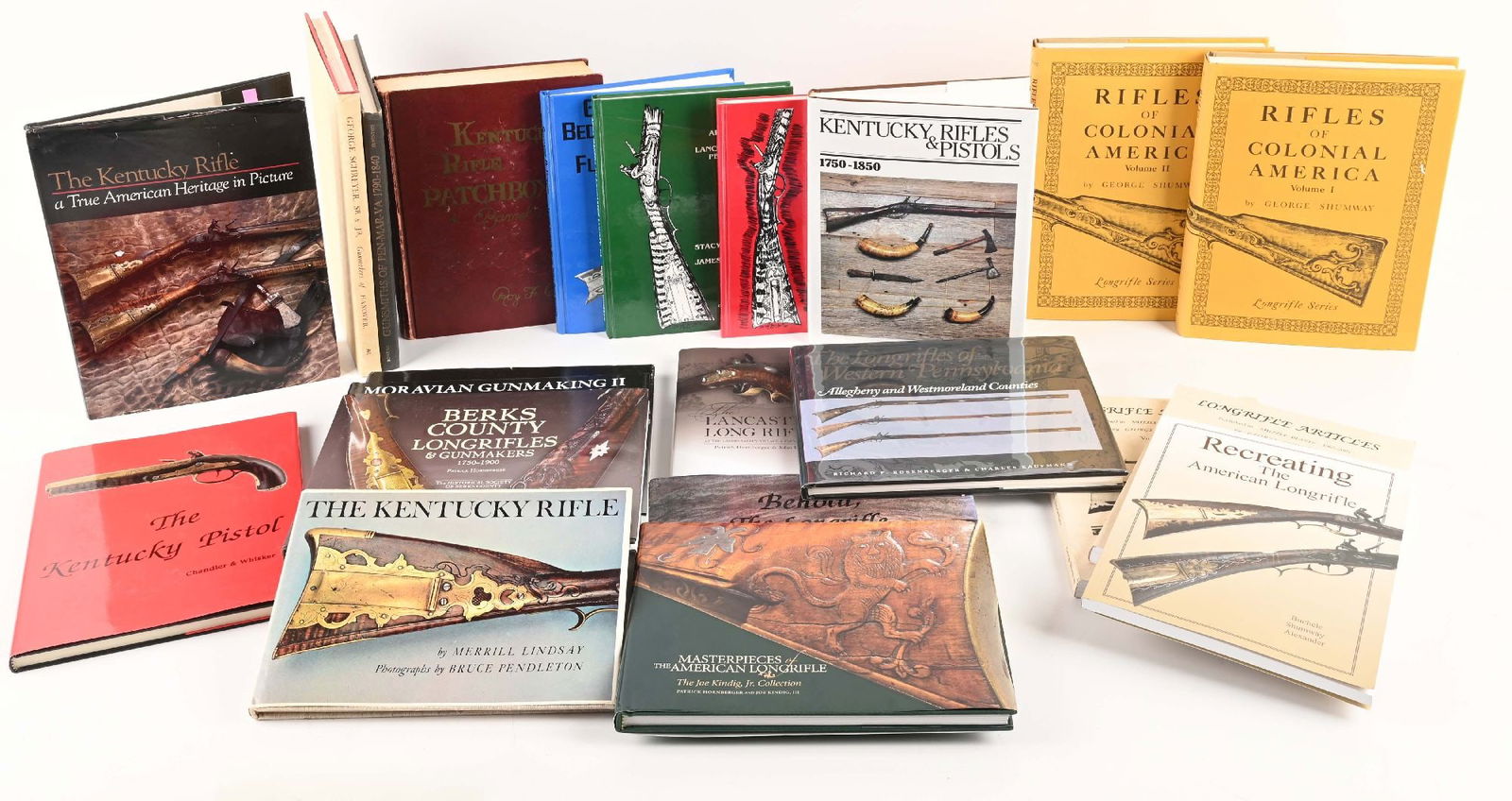 LOT OF 23: VALUABLE REFERENCE BOOK LIBRARY FOR THE PENNSYLVANIA KENTUCKY RIFLE. : Each book deals with Kentucky rifles with one book dealing with pistols. The first 12 books are all hardbound with dust jackets. 1&2 are a set by G. SHUMWAY entitled RIFLES OF COLONIAL AMERICA. 2002 &