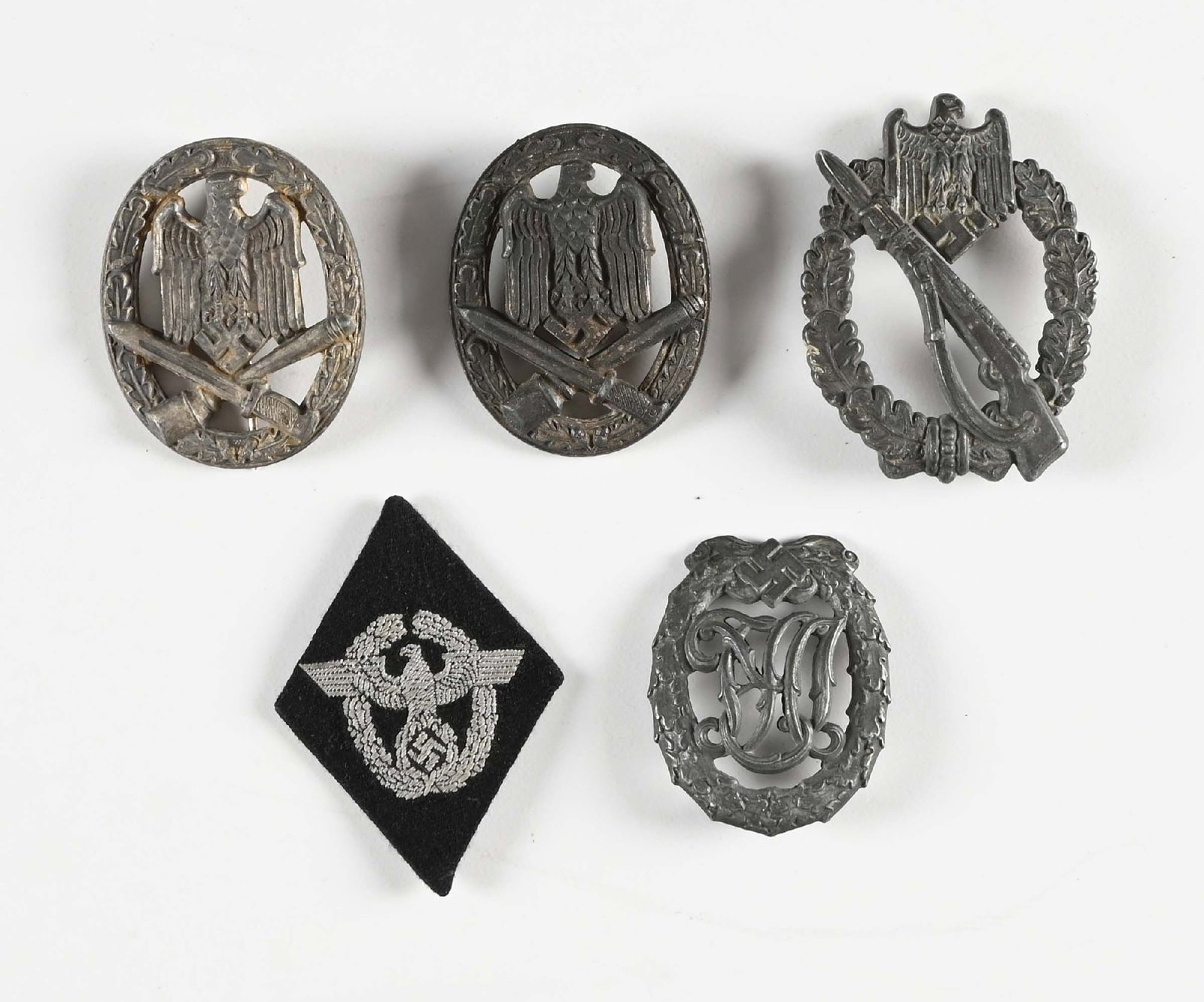 LOT OF 5: 4 THIRD REICH BADGES AND 1 POLICE PATCH.: Lot consists of: (A) Unmarked General Assault badge with crimped hinge and vertical pinback. Broken catch. (B) Unmarked General Assault badge with broken pinback and catch. (C) Unmarked Infantry Assau