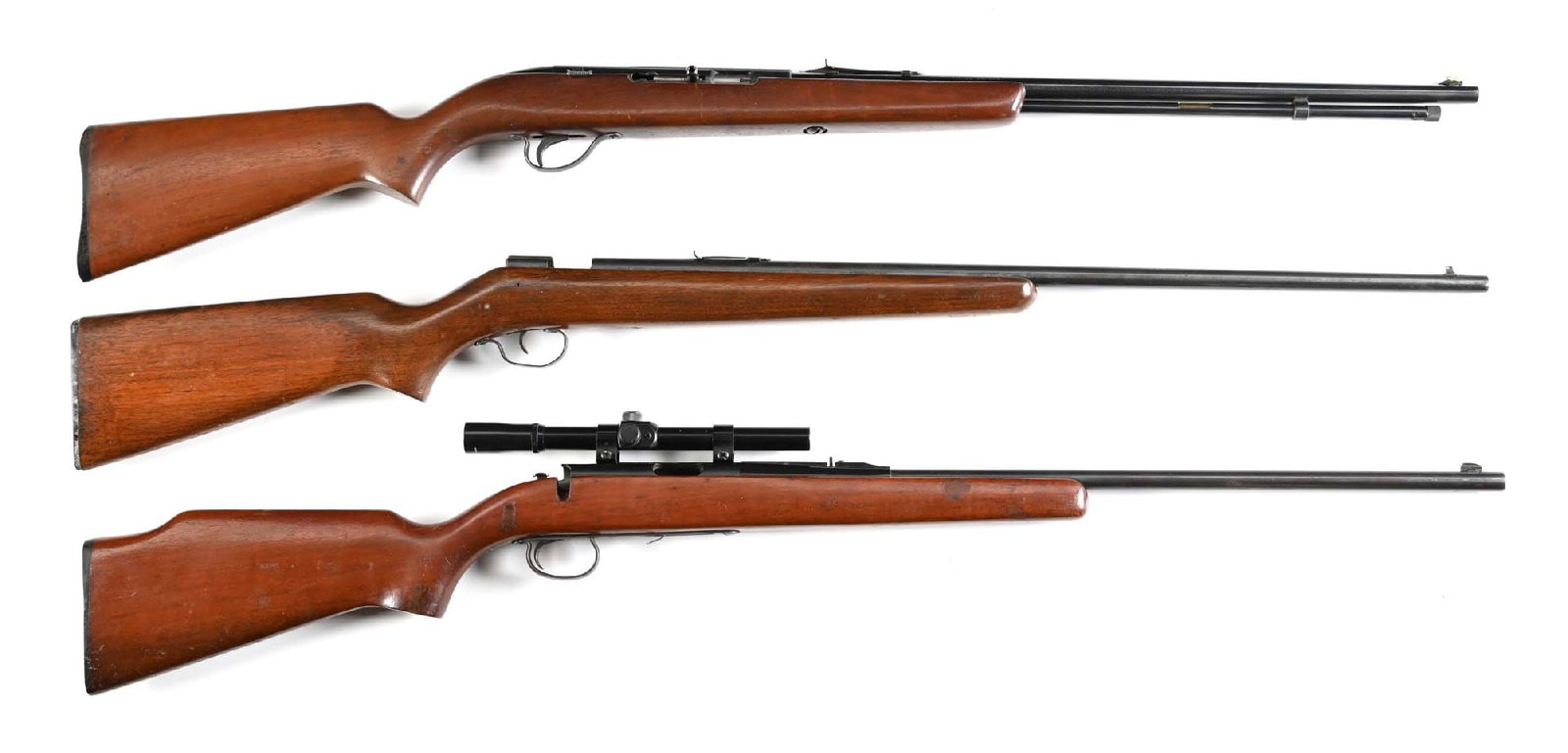 (C) LOT OF 3: J.C HIGGENS MODEL 25 WINCHESTER MODEL 67A AND A REMINGTON MODEL 581.: Gun (A) J.C Higgens model .22 caliber, round blued steel barrel, full length magazine tube with a blued finish and a plain walnut stock. CONDITION: Good, lightly frosted bore with good rifling. Gun (B