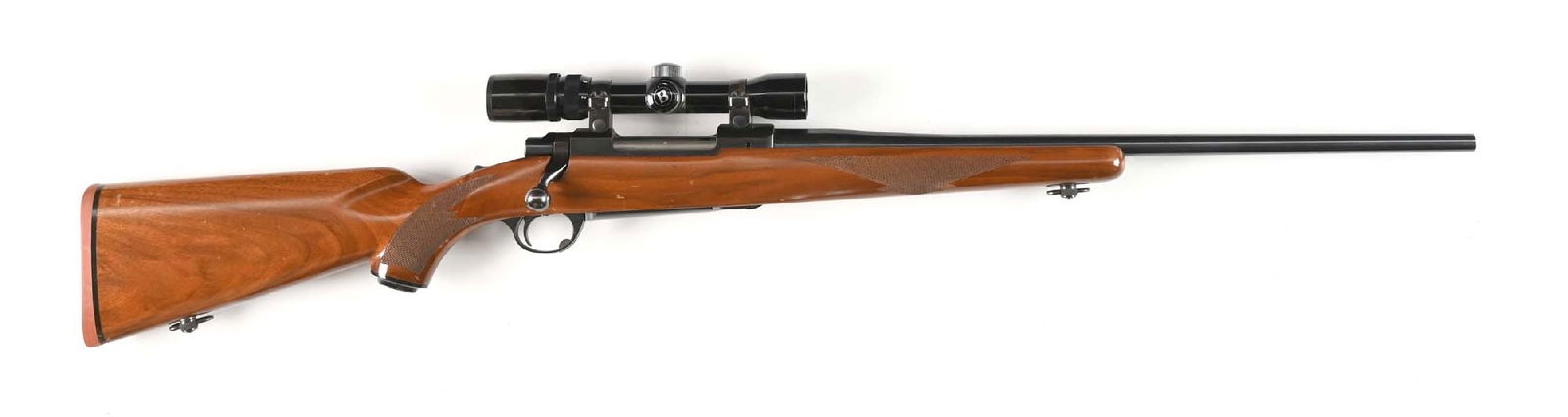 (C) RUGER M77 8MM MAUSER BOLT ACTION RIFLE.: Manufactured circa 1971. Features incleude a tapered blued barrel, Bushnell Banner 2-8x is mounted on Ruger proprietary rings, matte finished receiver, and one piece checkered walnut stock with a Ruge