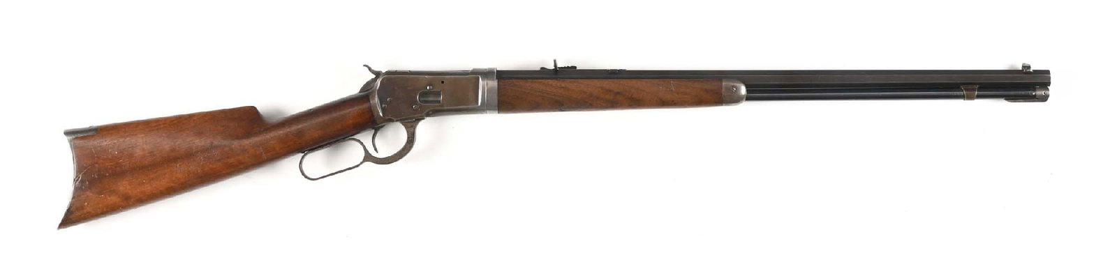 (C) WINCHESTER MODEL 1892 LEVER ACTION TAKEDOWN RIFLE (1906).: Manufactured in 1906. Features takedown, blue finish, octagon barrel, full tube, German silver front sight, semi-buckhorn rear sight, and walnut stock with rifle buttplate and matching forearm. CONDIT