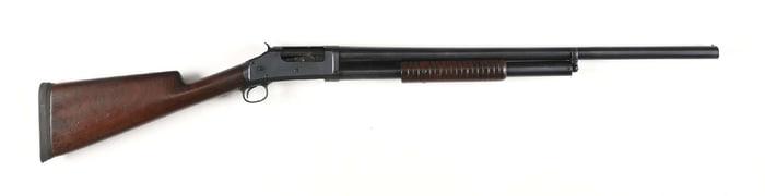 (C) EARLY SOLID FRAME WINCHESTER MODEL 1897 SLIDE ACTION SHOTGUN (1899).