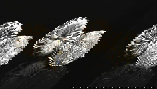 14K WHITE GOLD 4CT DIAMOND STUD EARRINGS W/ REPORT: Ladies' 14k white gold diamond stud earrings consisting of 2 round brilliant cut natural diamonds with a total weight of 4.03cts graded F-G color and I1 clarity. Width measures 8mm. Gross weight is 2.