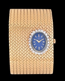 LADIES' 14K GOLD WIDE MESH OMEGA WATCH