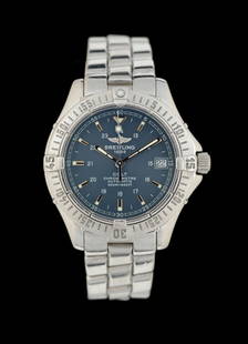 BREITLING 1884 COLT 38MM STEEL WRISTWATCH W/ PAPERS AND STRAP: Breitling 1884 Colt automatic chronometer 38mm wristwatch in stainless steel with date and blue dial. Reference number A17350. Includes original international warranty certificate, service booklet and