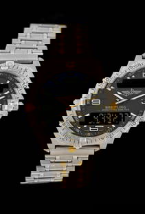 BREITLING 42MM TITANIUM AEROSPACE ANALOG/DIGITAL PILOT'S WRISTWATCH, REF. F65062: Men's Breitling 42mm titanium Aerospace analog/digital pilot's watch with titanium and gilt bracelet. Reference No. F65062. C. 2000. Charcoal gray dial. Measures 7-3/4" inside bracelet. Running. Inclu
