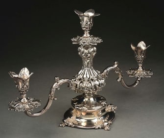 A REED & BARTON SILVER-PLATED THREE-LIGHT CANDELABRUM