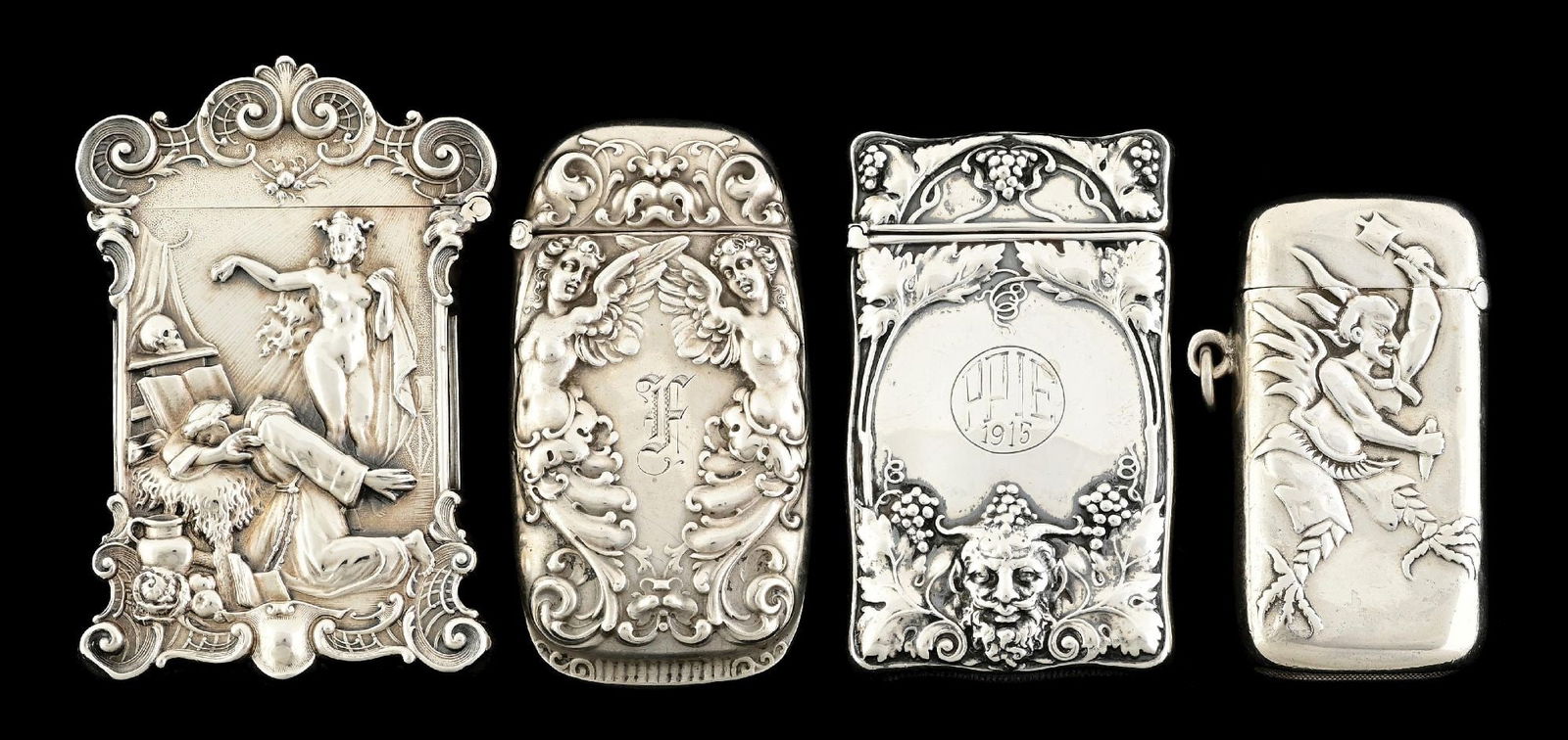 LOT OF 4: STERLING SILVER MATCH SAFES: (A) Temptation of St. Joseph. Ornate depiction by William Kerr. (B) Winged devil motif by Carter & Howe. Dent on back. (C) Bacchus, God of Wine by Gorham, 1915. (D) Two winged angels by Gorham. Small