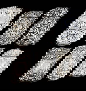 LOT OF 6: STERLING SILVER MATCH SAFES: (A) Scroll design on both sides by Scheibler. (B) Ornate design with monogram by Gilbert. (C) Unusual design by Gorham with monogram on back. (D) Jester faces and floral design with monogram by Gilber
