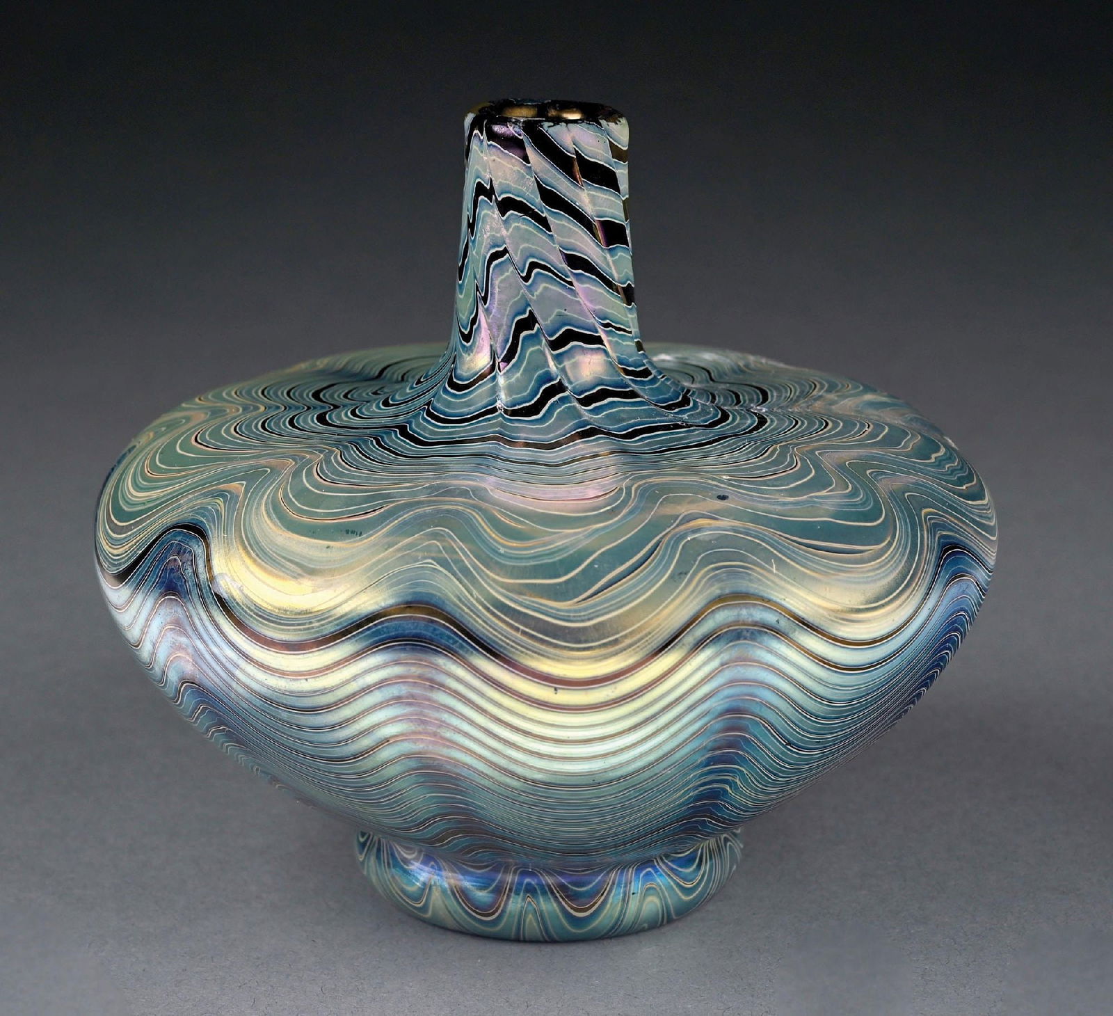 RUBIN LOETZ VASE: C. 1899, PG 7966, PN 7990. A gorgeous example of a Loetz Rubin vase. The 4-1/4" tall vase has a 4-1/2" diameter at its widest. It has a round, wide-bodied form with very tapered neck and mouth. The va