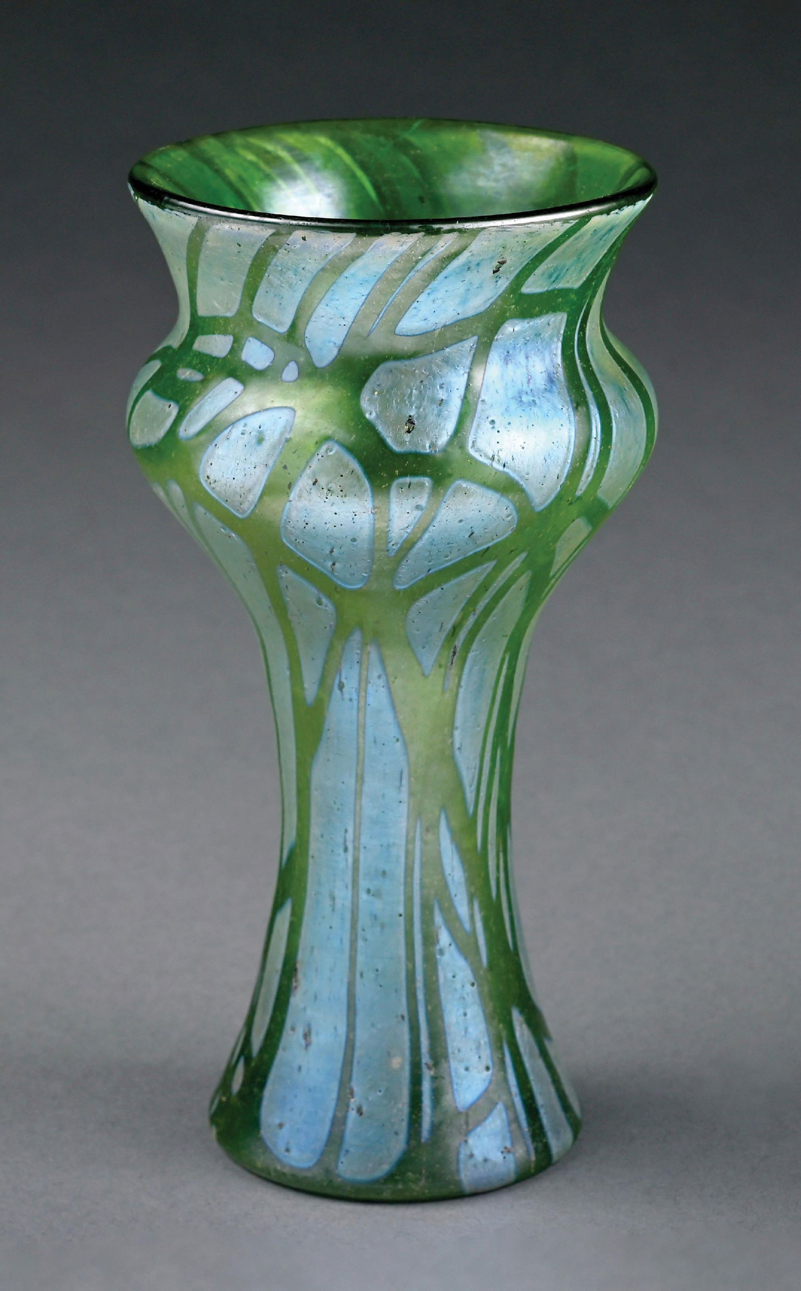 CRETA LOETZ PAMPAS VASE: C. 1900, Pampas, PN II-83. A lovely vase by Loetz with Creta Pampas-style. The 5-1/2" tall vase has a narrow form at the neck, which flares out at the mouth. It is composed of soft green glass with lo