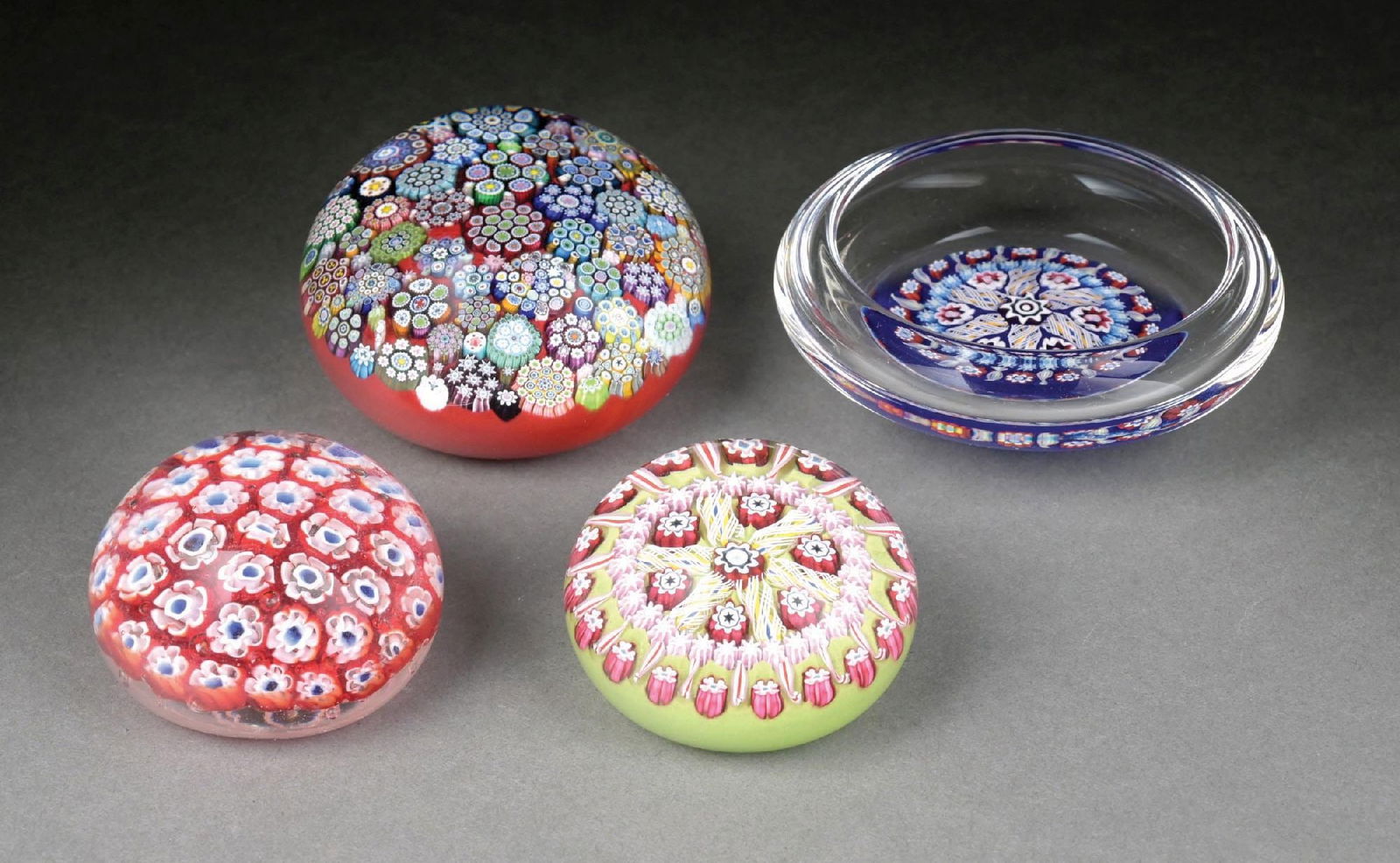 LOT OF 4: SPACED MILLEFIORI CLOSEPACK PAPERWEIGHTS: Nice grouping of millefiori-style paperweights. Condition: (Excellent). Dimensions: largest: 4" x 4" x 1-1/2".