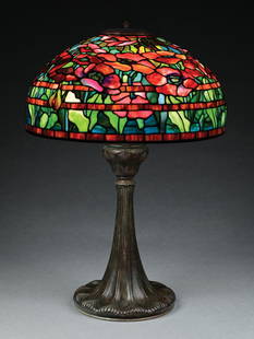 TIFFANY STUDIOS ORIENTAL POPPY LEADED GLASS TABLE LAMP: An absolutely stunning example of the rare oriental poppy table lamp by Tiffany Studios. The 18" diameter shade features the iconic oriental poppy pattern with flowers in multicolored reds, ranging fr