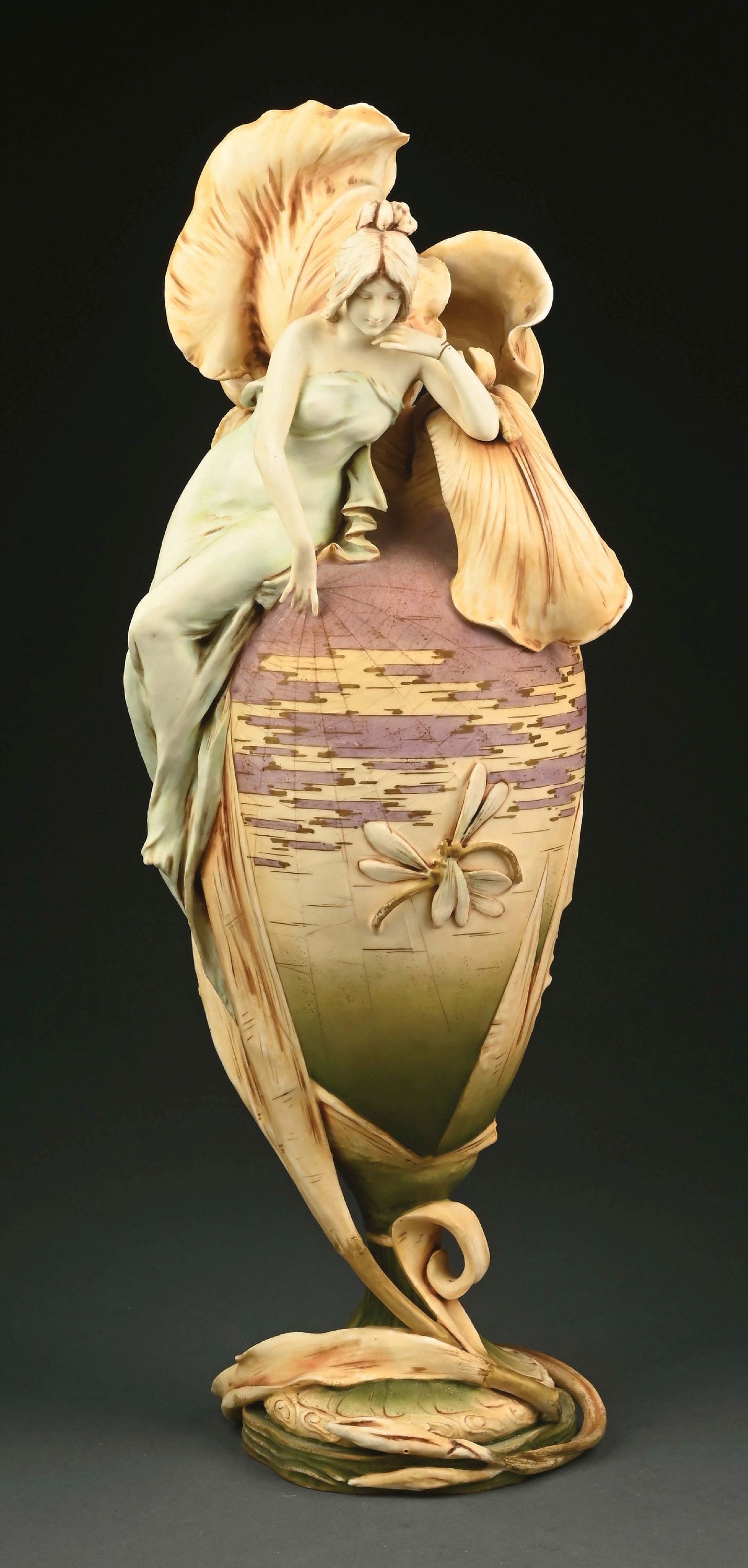 RARE 1900 PARIS EXPOSITION MONUMENTAL IRIS LADY VASE: Applied irises, dragonflies and Art Nouveau maiden welcoming the day. Crisp water color matte glazes. Signed with 1900 Paris Expo mark, Amphora oval, RSTK and impressed "740." The vase has been repair