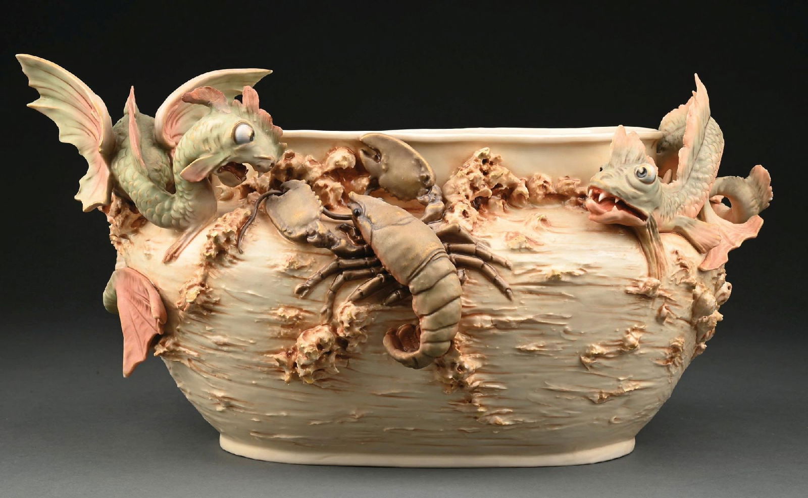 ROYAL DUX FANTASY JARDINIERE: Rare Bohemia jardiniere featuring sea monsters or dragons and a lobster. Raised triangle marking. Condition: (Excellent). Dimensions: 18" x 9" x 9 - 1/2".