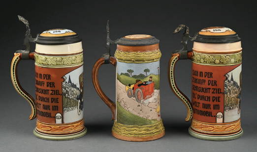 LOT OF 3: GERMAN STEINS WITH AUTOMOTIVE SCENES: Featuring two Mettlach German pottery beer steins. Marked 3202, which is titled "Automobile." Both steins have an automobile etching with German text. One of the steins has a bent thumb-lever, and als