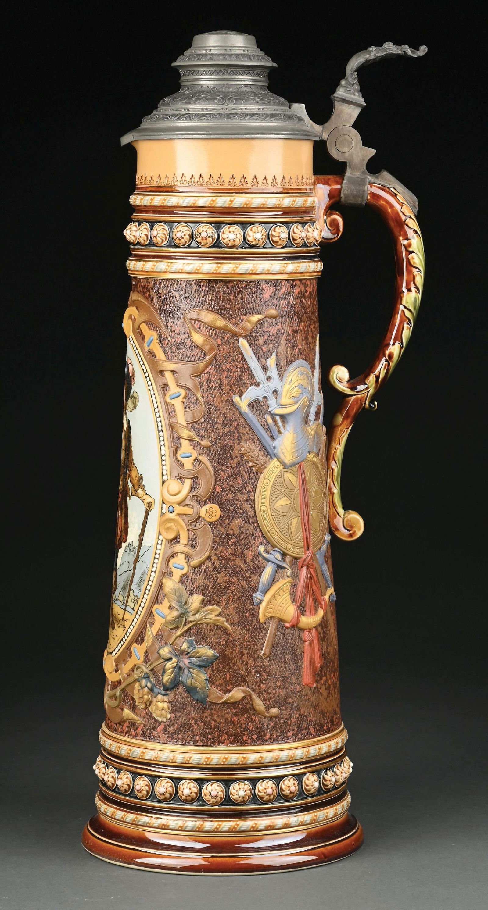 METTLACH TRUMPETER NO. 1562: The Trumpeter of Säckingen is the title character in a poem written in 1853 by Josef Viktor von Scheffel. 5.6L with pewter lid. incredible details. Small repair shown on the handle. Condition: (E