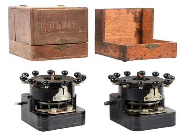 PAIR OF AUTOMATIC BANK PUNCHES IN ORIGINAL SHIPPING CRATES