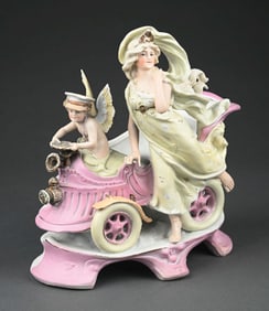 GERMAN BISQUE CHERUB DRIVING A GODDESS