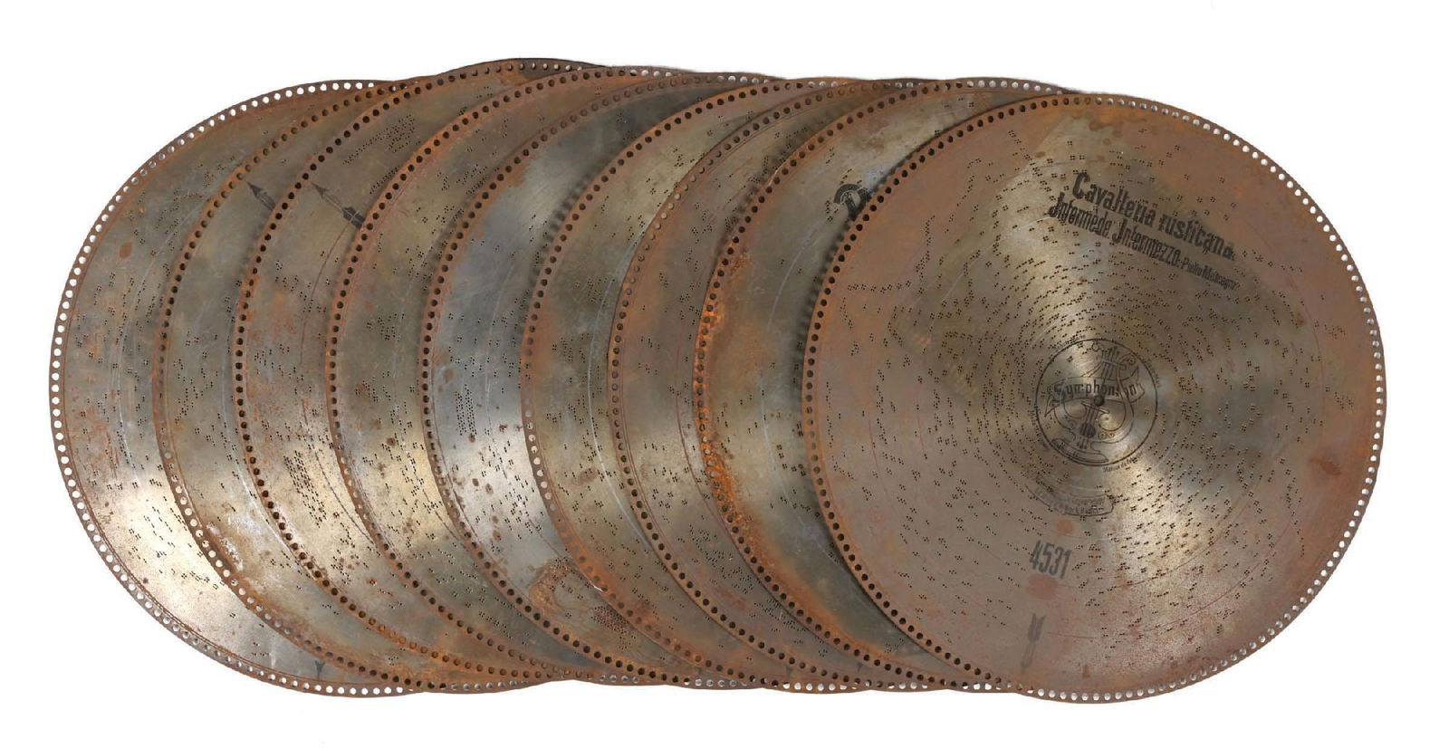 LOT OF MUSIC BOX DISCS: A selection of music box discs in various conditions. Be sure to view photos online. Qty: 10 - 24-3/4" dia. Condition: (Good). Dimensions: each: 24-3/4" dia.