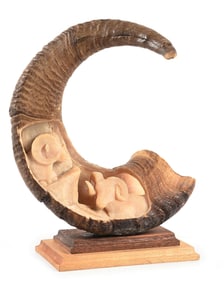 A ROCKY MOUNTAIN BIG HORN SHEEP CARVED HORN
