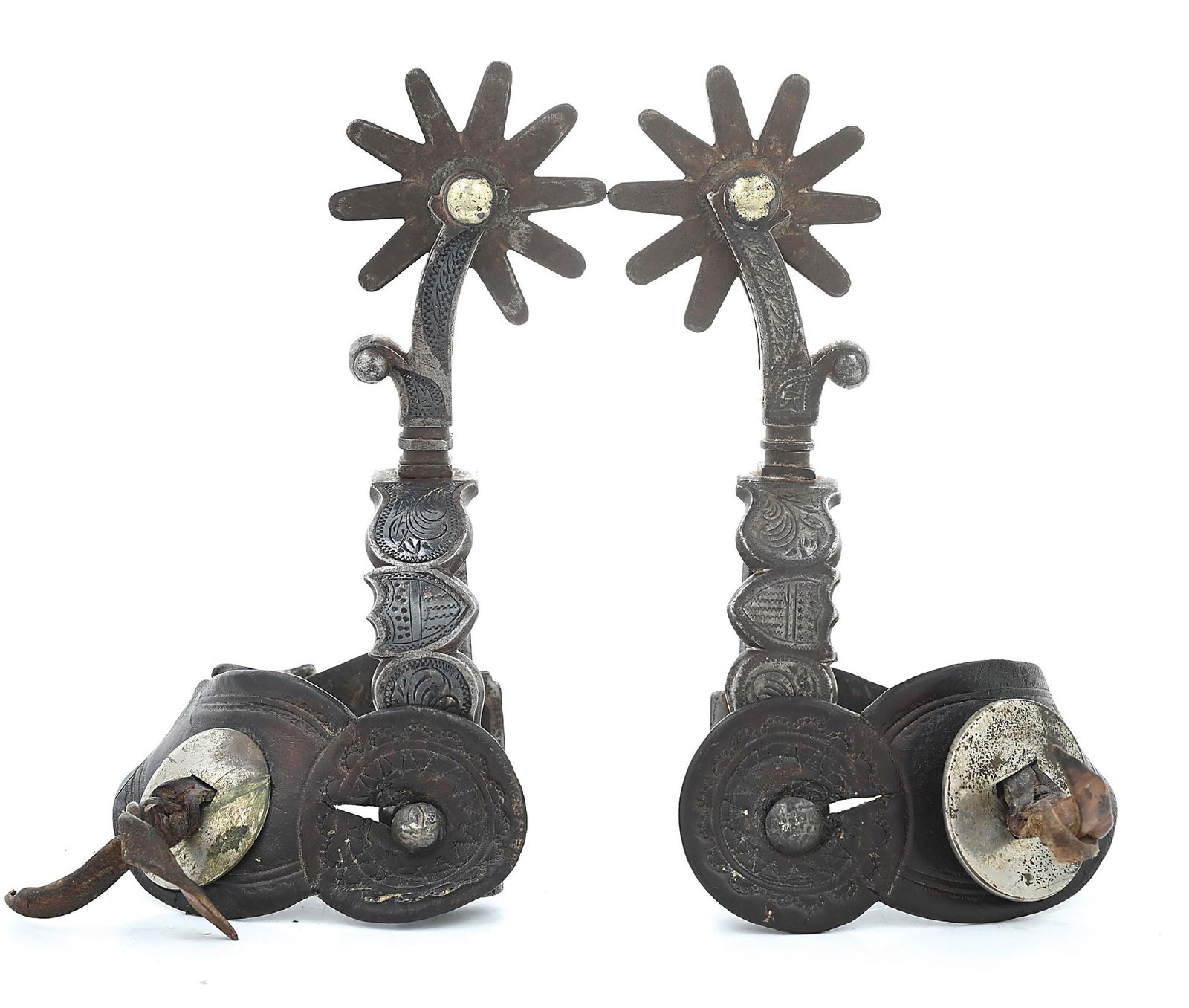 CODY, WYOMING COWGIRL ANNA LUCYLLE MOON HALL'S PERSONAL SPURS: Large August Buermann silver inlaid "Federal Shield" pattern spurs with a 1" band, 2 1/2" shank and 2 1/2" rowel. Replaced rowels, nice vintage original straps. A local legend Anna Lucylle "Skipper" M