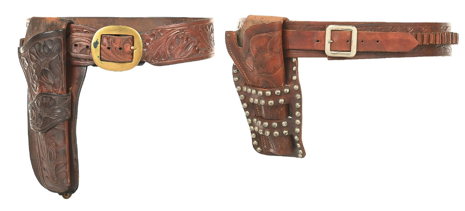 LOT OF 2 H. H. HEISER GUN RIGS: a) Deeply tooled single loop holster, 11" overall and trimmed cartridge belt 35 1/2" long and 2 1/2" wide. b) Double loop studded and floral carved holster is 9 1/4" overall and the cartridge belt mea
