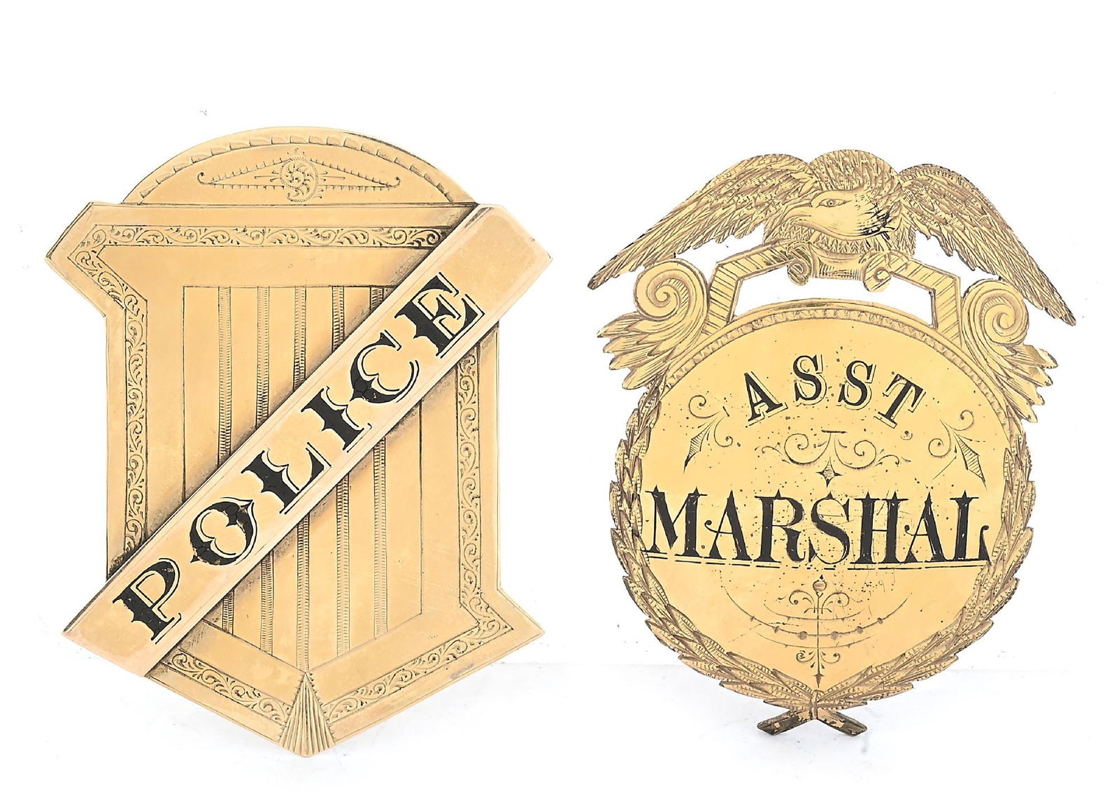 LOT OF 2 VINTAGE GOLD BADGES: a) Gold eagle topped Asst. Marshal badge with great wreath edges, fancy font and detailed engraving. Tests at 12K on the surface. Hallmarked on the reverse "J.P. Lovell & Sons / Boston". 2 3/4" x 2 1/