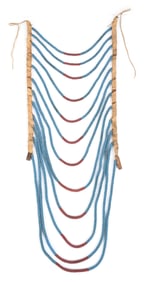 A CROW OR PLATEAU BLUE AND RED BEADED BREASTPLATE
