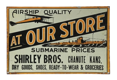SHIRLEY BROTHERS DRY GOODS EMBOSSED TIN SIGN W/ SHIP & AIRPLANE GRAPHICS