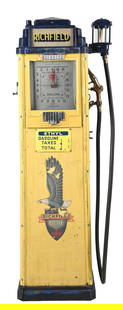 BENNETT MODEL #77 GAS PUMP IN RICHFIELD GASOLINE: C. 1930s. CONDITION: Pump is in near original condition, showing original porcelain pricers as well as remnants of original decals and ad glass. The blue areas show older repaint, and the pump is miss