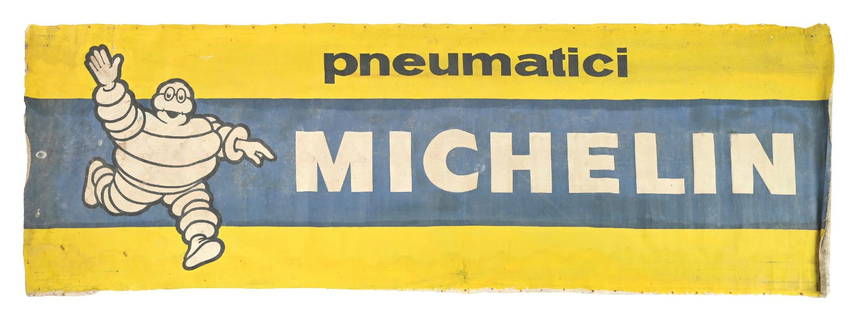 LARGE MICHELIN TIRES CLOTH BANNER WITH BIBENDUM GRAPHIC: Single-Sided Cloth Banner for Michelin Tires. CONDITION: Banner shows very good color, with general wear throughout the inner and outer field. Banner appears to have been stretched at one time,
