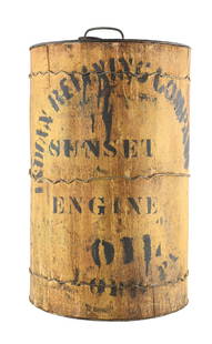 RARE INDIAN REFINING COMPANY SUNSET ENGINE OIL WOOD COVERED OIL CAN: Five gallon round can. C. 1910s. Indian Refining Company. CONDITION: Overall good, showing a large majority of its original stenciling present. Can shows areas of age wear present, but no heavy damage