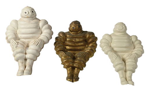 COLLECTION OF 3: MICHELIN TIRES FIGURAL BIBENDUM ADVERTISING STATUES.: Collection consists of: Three individual advertising figures from Michelin Tires, one made of plastic, one made of paper mache and one from composition. CONDITION: Each in fair condition showing light