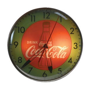 DRINK COCA-COLA PAM ADVERTISING LIGHT-UP CLOCK: C. 1950s. CONDITION: Clock is in working condition and lights up nicely. Advertising face shows moderate wear with areas of light paint fade and surface scratch. Outer glass and metal body showing onl